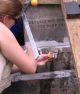33-Nicole creates a faux mortar joint at the bottom of the headstone.